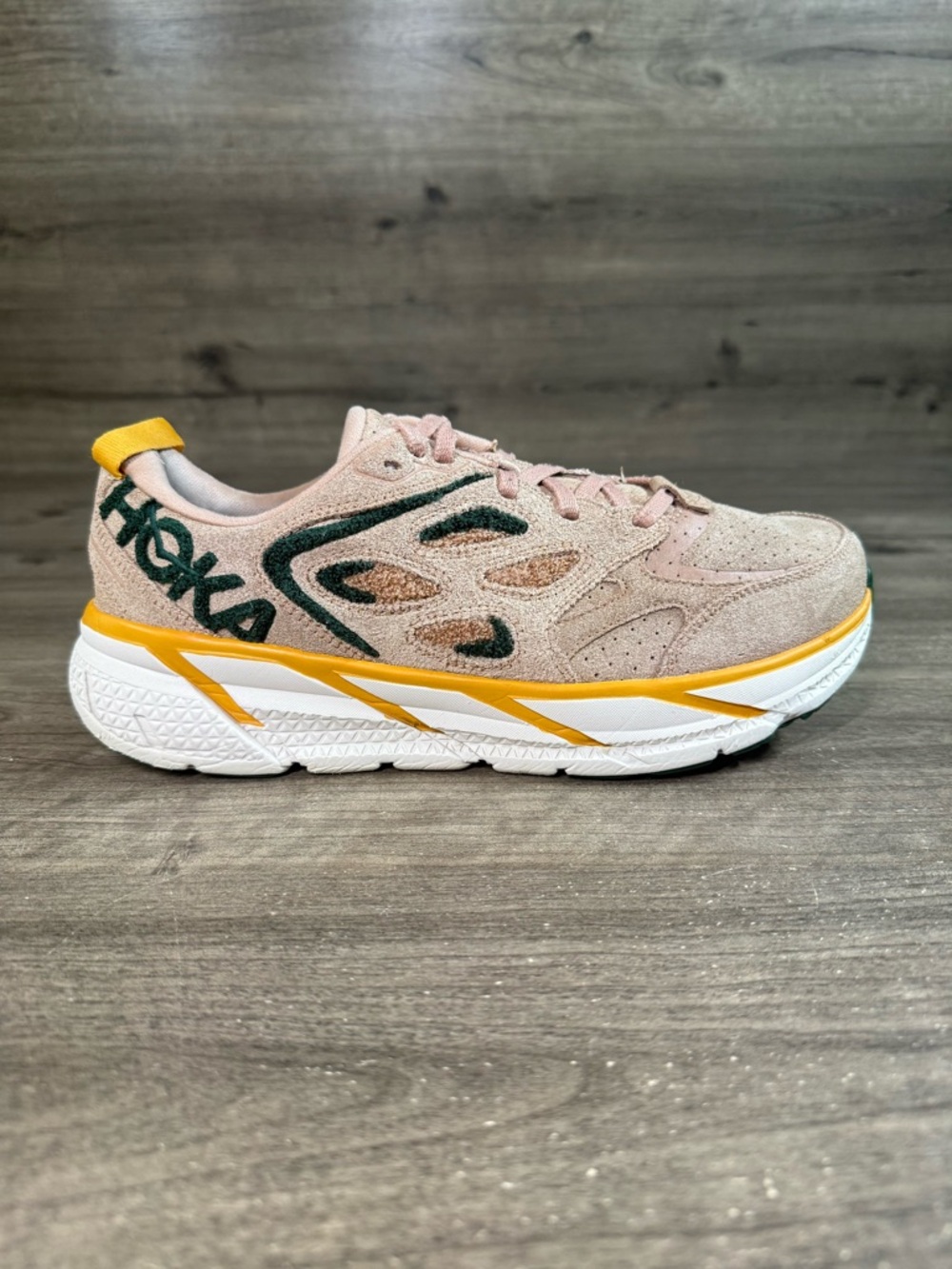 Hoka One One Athletic Shoe in Blush Pink with Yellow and Dark Green Accents